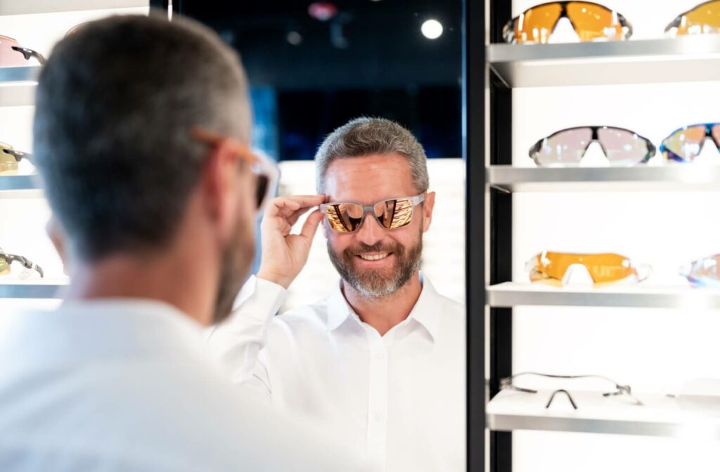 A patient trying on protective eyewear to wear during pickleball games.